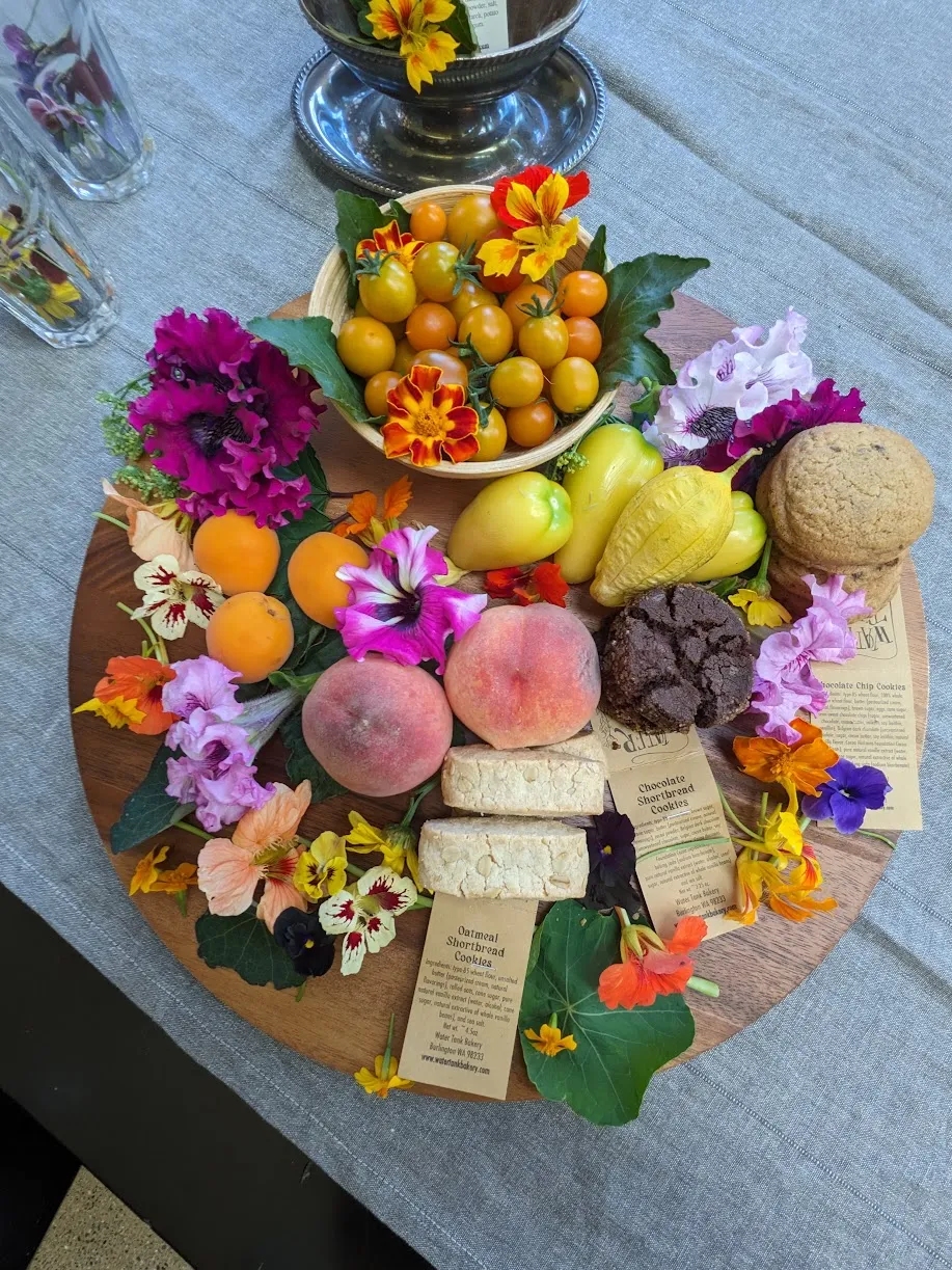 A grazing board with lots of beautiful flowers